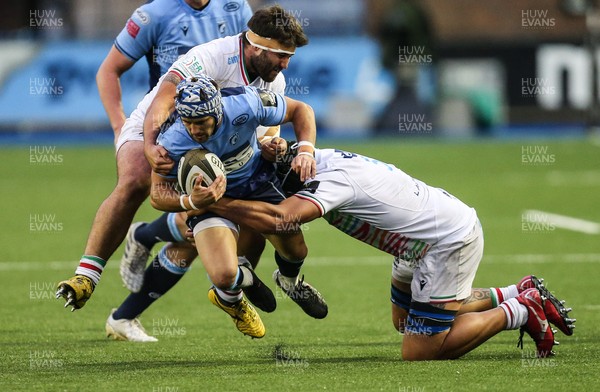 050621 - Cardiff Blues v Zebre, Guinness PRO14 Rainbow Cup - Matthew Morgan of Cardiff Blues is tackled by Paolo Buonfiglio of Zebre and Leonard Krumov of Zebre