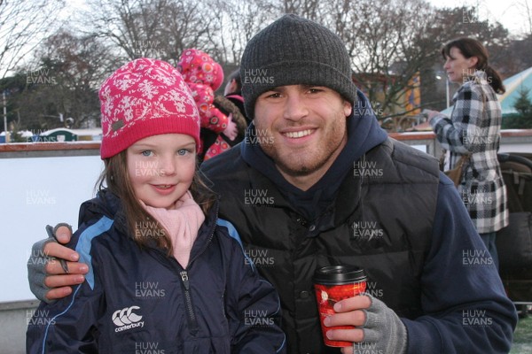 22.12.09 Cardiff Blues at The Winter Wonderland -  Jamie Roberts poses for a photo with a young Blues fan at The Winter Wonderland. 