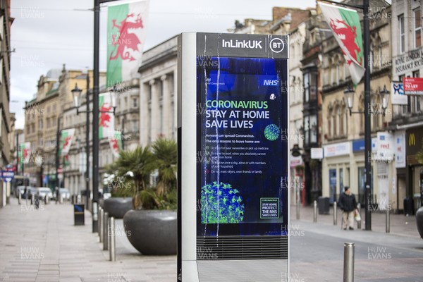 300320 - Cardiff City Centre Lockdown - Coronavirus message being shown in the centre