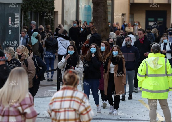 120421 - Picture shows shoppers outside Primark in Cardiff City Centre, Wales this morning on the first day non essential shops are allowed to be open since December 2020 during the coronavirus pandemic