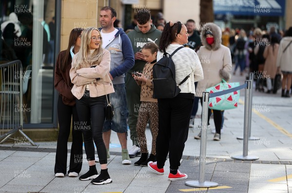 120421 - Picture shows shoppers in Cardiff City Centre, Wales this morning on the first day non essential shops are allowed to be open since December 2020 during the coronavirus pandemic