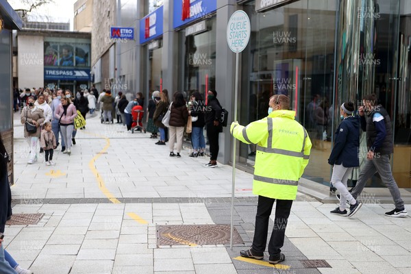 120421 - Picture shows shoppers in Cardiff City Centre, Wales this morning on the first day non essential shops are allowed to be open since December 2020 during the coronavirus pandemic