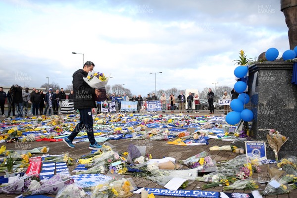 250119 - Picture shows Cardiff City CEO Ken Choo paying his respects at the Cardiff City Stadium amongst the tributes to Emiliano Sala who was involved in a plane crash over the channel on Monday night