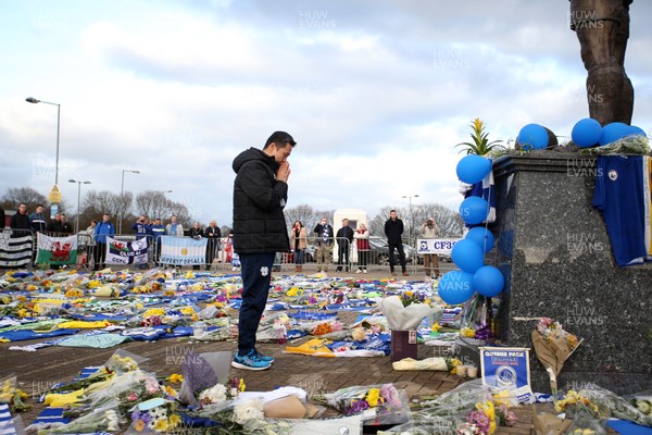 250119 - Picture shows Cardiff City CEO Ken Choo paying his respects at the Cardiff City Stadium amongst the tributes to Emiliano Sala who was involved in a plane crash over the channel on Monday night