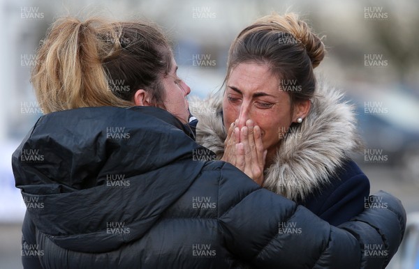 250119 - Picture shows the sister of footballer Emiliano Sala Romina consoled by cousin and partner as she looks on at all the tributes at Cardiff City Stadium for her brother, who was involved in a plane crash over the channel on Monday night