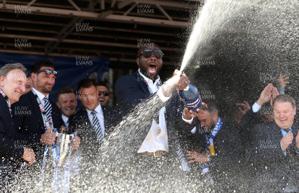 130518 - Cardiff City Open top bus tour to celebrate being promoted into the Premier League - Souleymane Bamba sprays champagne