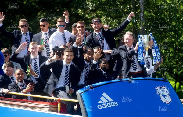 130518 - Cardiff City Premier League Promotion Parade - Neil Warnock holds the trophy and celebrates with his players during an open top bus parade