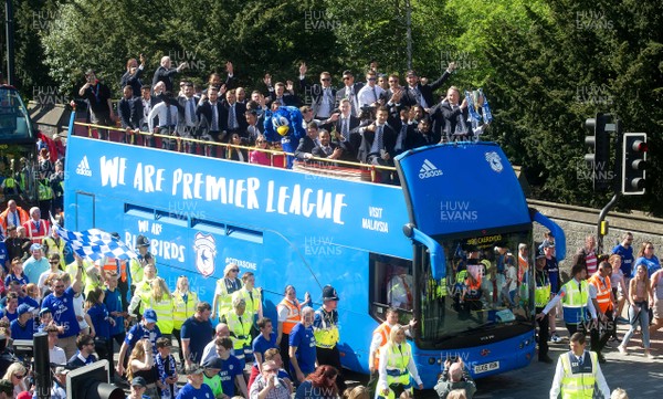 130518 - Cardiff City Premier League Promotion Parade - Neil Warnock holds the trophy and celebrates with his players during an open top bus parade