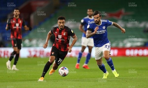 211020 - Cardiff City v AFC Bournemouth, Sky Bet Championship - Junior Stanislas of Bournemouth holds off Marlon Pack of Cardiff City