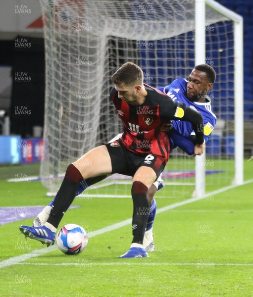211020 - Cardiff City v AFC Bournemouth, Sky Bet Championship - Junior Hoilett of Cardiff City and Chris Mepham of Bournemouth compete for the ball