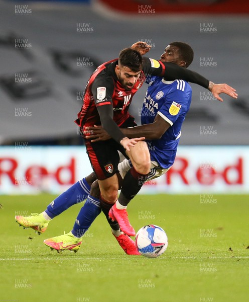 211020 - Cardiff City v AFC Bournemouth, Sky Bet Championship - Sheyi Ojo of Cardiff City and Diego Rico of Bournemouth tangle as they compete for the ball