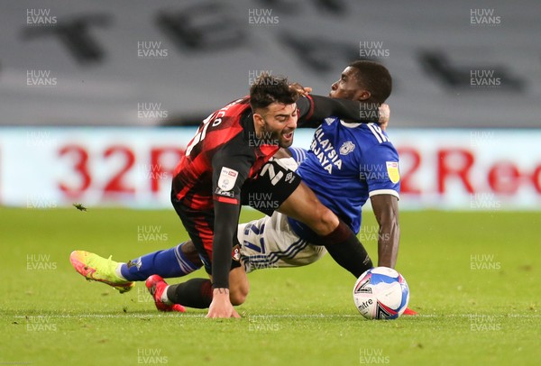 211020 - Cardiff City v AFC Bournemouth, Sky Bet Championship - Sheyi Ojo of Cardiff City and Diego Rico of Bournemouth tangle as they compete for the ball
