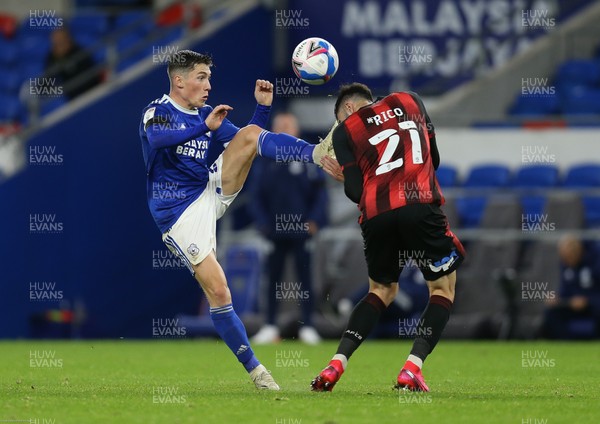 211020 - Cardiff City v AFC Bournemouth, Sky Bet Championship - Harry Wilson of Cardiff City wins the ball from Diego Rico of Bournemouth