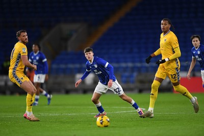 021225 -  Cardiff City v AFC Wimbledon - Vertu Trophy - Troy Perrett of Cardiff City is challenged by Alistair Smith of Wimbledon