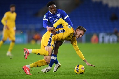 021225 -  Cardiff City v AFC Wimbledon - Vertu Trophy - Dakarai Mafico of Cardiff City is challenged by Callum Maycock of Wimbledon