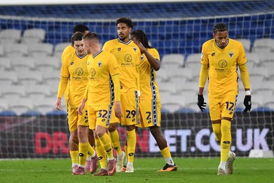 021225 -  Cardiff City v AFC Wimbledon - Vertu Trophy - Aron Sasu of Wimbledon celebrates scoring a goal with team mates
