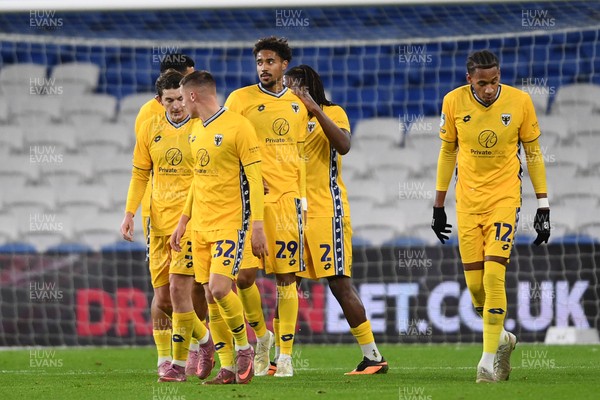 021225 -  Cardiff City v AFC Wimbledon - Vertu Trophy - Aron Sasu of Wimbledon celebrates scoring a goal with team mates
