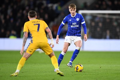 170226 - Cardiff City v AFC Wimbledon - Sky Bet League 1 - Joel Bagan of Cardiff City is challenged by James Tilley of Wimbledon