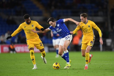 170226 - Cardiff City v AFC Wimbledon - Sky Bet League 1 - Joel Colwill of Cardiff City is challenged by Myles Hippolyte and Callum Maycock of Wimbledon