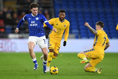 170226 - Cardiff City v AFC Wimbledon - Sky Bet League 1 - Ollie Tanner of Cardiff City is challenged by James Tilley of Wimbledon