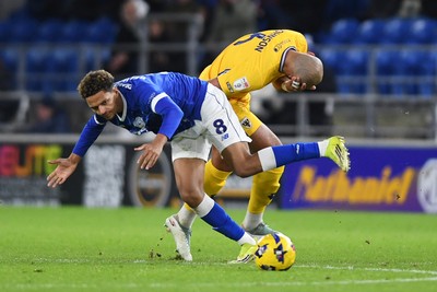170226 - Cardiff City v AFC Wimbledon - Sky Bet League 1 - Omari Kellyman of Cardiff City is challenged by Ryan Johnson of Wimbledon