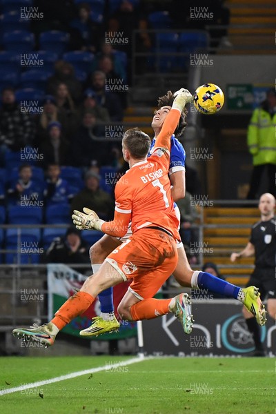 170226 - Cardiff City v AFC Wimbledon - Sky Bet League 1 - Nathan Bishop of Wimbledon attempts to punch the ball away but makes contact with Joel Colwill of Cardiff City
