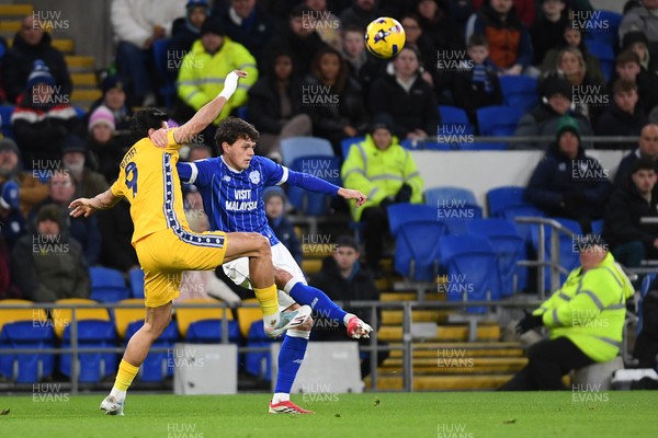 170226 - Cardiff City v AFC Wimbledon - Sky Bet League 1 - Perry NG of Cardiff City is challenged by Omar Bugiel of Wimbledon