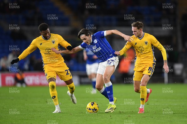 170226 - Cardiff City v AFC Wimbledon - Sky Bet League 1 - Joel Colwill of Cardiff City is challenged by Myles Hippolyte and Callum Maycock of Wimbledon
