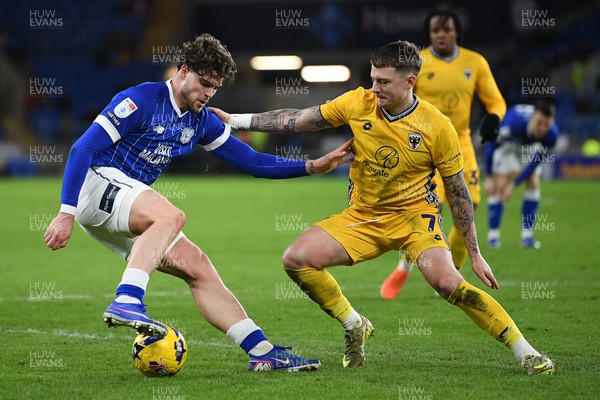 170226 - Cardiff City v AFC Wimbledon - Sky Bet League 1 - Ollie Tanner of Cardiff City is challenged by James Tilley of Wimbledon