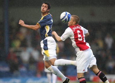 01.08.08 -  Cardiff City v AFC Ajax, Pre-season friendly. Cardiff City's Roger Johnson wins the ball from Ajax's Rasmus Lindgren  