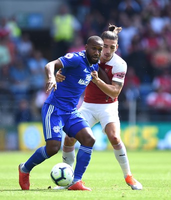 020918 - Cardiff City v Arsenal - Premier League - Junior Hoilett of Cardiff City is tackled by Hector Bellerin of Arsenal