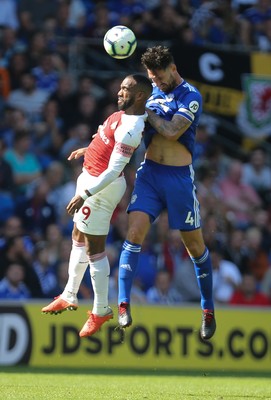 020918 - Cardiff City v Arsenal, Premier League - Sean Morrison of Cardiff City and Alexandre Lacazette of Arsenal compete for the ball