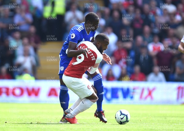 020918 - Cardiff City v Arsenal - Premier League - Alexandre Lacazette of Arsenal is tackled by Souleymane Bamba of Cardiff City