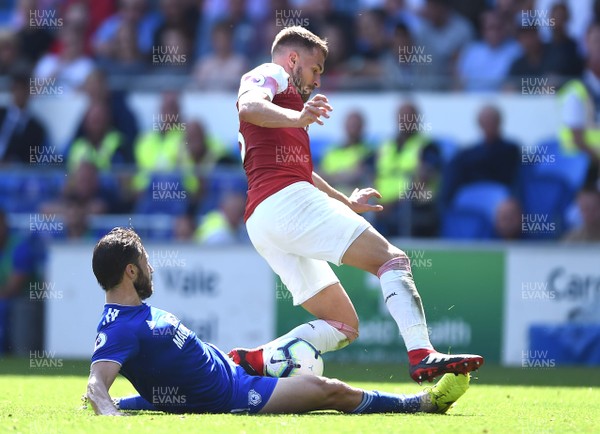 020918 - Cardiff City v Arsenal - Premier League - Aaron Ramsey of Arsenal is tackled by Harry Arter of Cardiff City