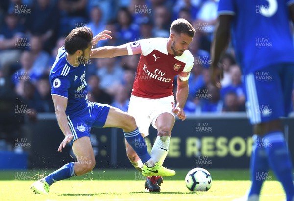 020918 - Cardiff City v Arsenal - Premier League - Aaron Ramsey of Arsenal is tackled by Harry Arter of Cardiff City