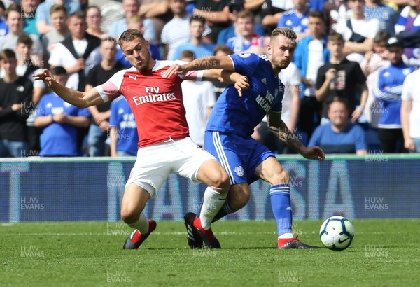 020918 - Cardiff City v Arsenal, Premier League - Joe Ralls of Cardiff City is challenged by Aaron Ramsey of Arsenal