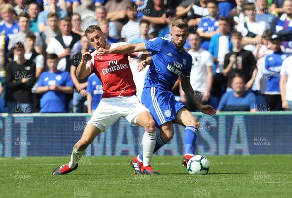 020918 - Cardiff City v Arsenal, Premier League - Joe Ralls of Cardiff City is challenged by Aaron Ramsey of Arsenal