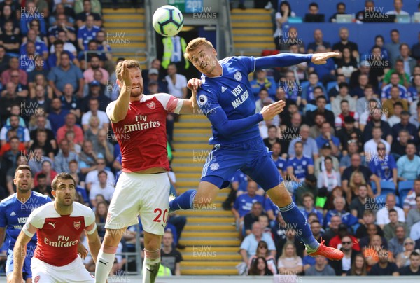 020918 - Cardiff City v Arsenal, Premier League - Danny Ward of Cardiff City and Shkodran Mustafi of Arsenal compete for the ball in the air