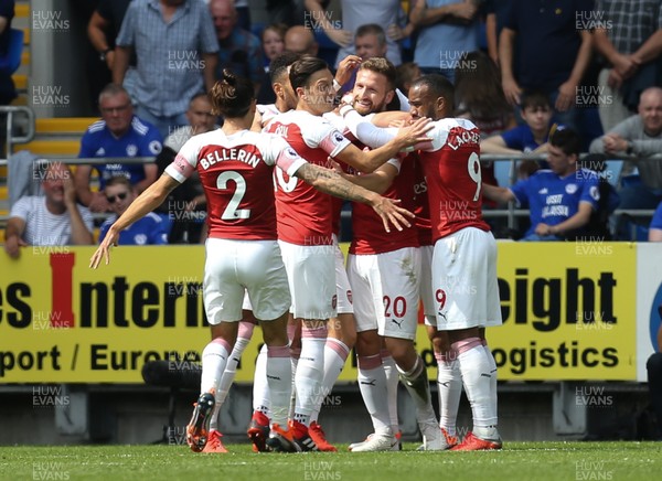 020918 - Cardiff City v Arsenal, Premier League - Arsenal players celebrate after Shkodran Mustafi of Arsenal, centre, scores the opening goal