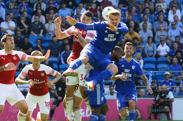 020918 - Cardiff City v Arsenal, Premier League - Danny Ward of Cardiff City challenges Granit Xhaka of Arsenal for the ball