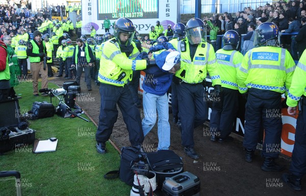 25.01.09 - Cardiff City v Arsenal - FA Cup - A Cardiff City fan is lead away by police after trouble between fans at the end of the game. 