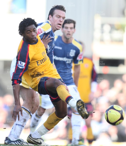 25.01.09 - Cardiff City v Arsenal, FA Cup Round 4 -  Arsenals Alex Song holds off Cardiff's Gavin Rae 