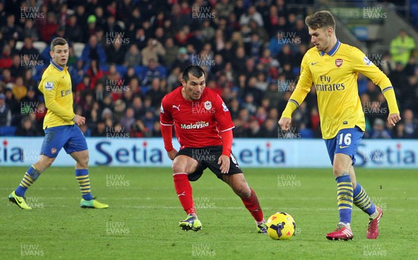 301113 - Cardiff City vs Arsenal - Barclays Premier League - Aaron Ramsey of Arsenal takes on Gary Medel of Cardiff(c) Huw Evans Agency