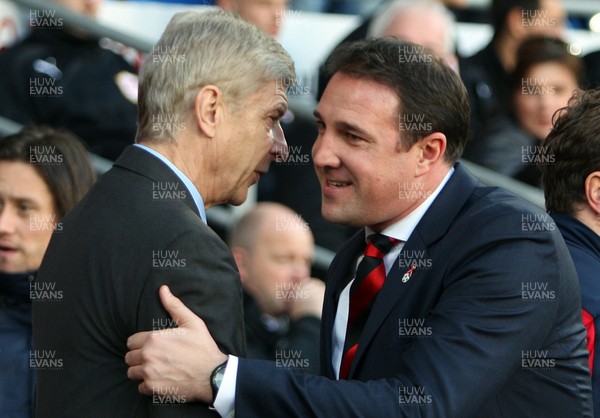 301113 - Cardiff City vs Arsenal - Barclays Premier League - Arsene Wenger is greeted by Malky Mackay(c) Huw Evans Agency