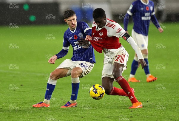 111125 - Cardiff City v Arsenal U21 - Vertu Trophy - Troy Perrett of Cardiff City is challenged by Ife Ibrahim of Arsenal U21 