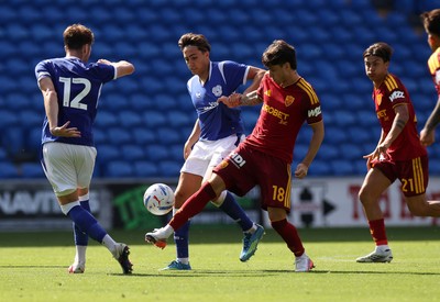 010826 - Cardiff City v AS Roma - Pre Season Friendly - Matias Soule of Roma is challenged by Joel Colwill of Cardiff 