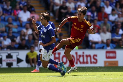 010826 - Cardiff City v AS Roma - Pre Season Friendly - Paulo Dybala of Roma is challenged by Joel Colwill of Cardiff 