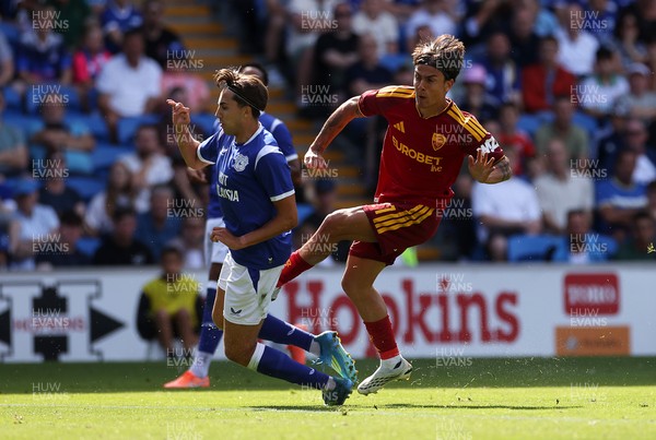 010826 - Cardiff City v AS Roma - Pre Season Friendly - Paulo Dybala of Roma is challenged by Joel Colwill of Cardiff 