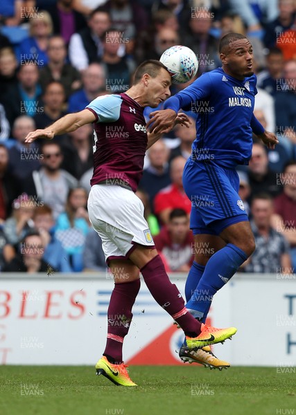 120817 - Cardiff City v Aston Villa - SkyBet Championship - John Terry of Aston Villa and Kenneth Zohore of Cardiff City go up for the ball