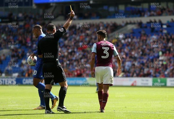120817 - Cardiff City v Aston Villa - SkyBet Championship - Neil Taylor of Aston Villa is given a yellow card for his tackle on Nathaniel Mendez-Laing of Cardiff City